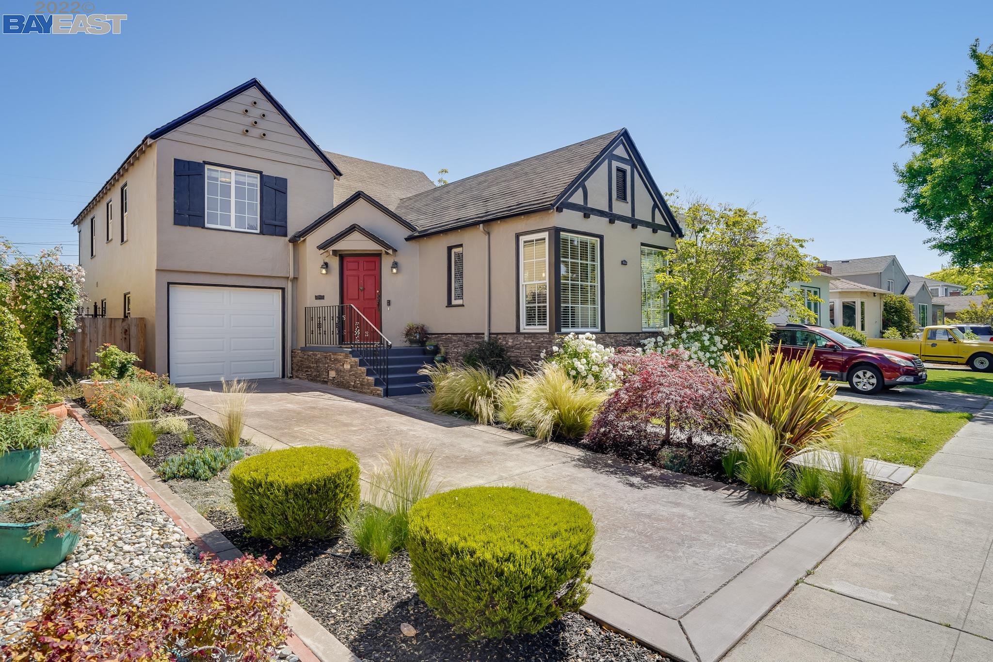 2925 Windsor Drive Alameda, CA 94501 - Photo 1 of 1 a front view of a house with a yard garage and outdoor seating