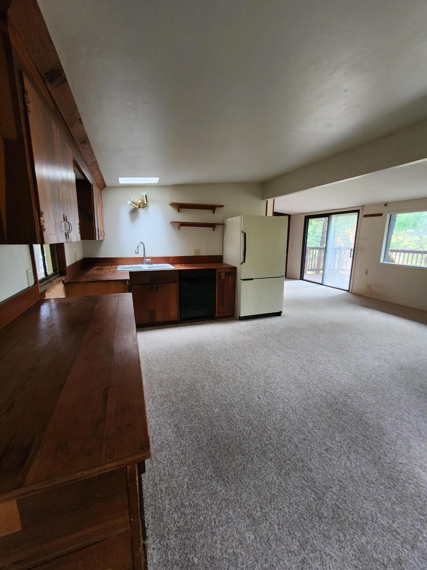 330 Lake Road Junction City, CA 96048 - Photo 14 of 50 a large white kitchen with stainless steel appliances a large window