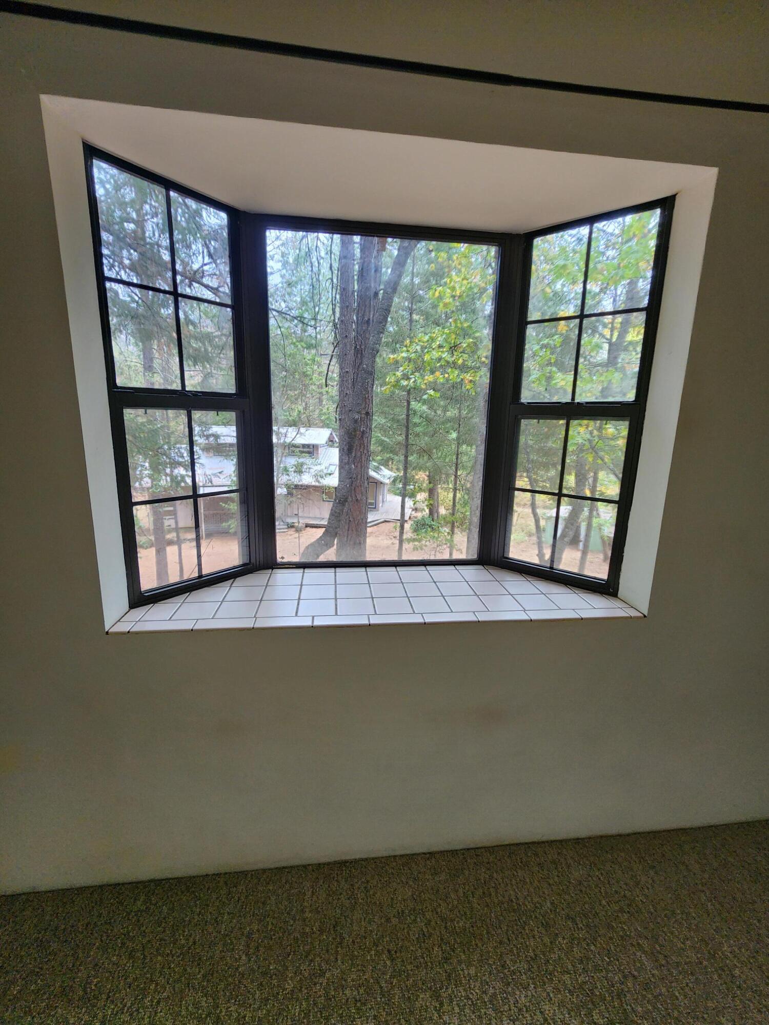 330 Lake Road Junction City, CA 96048 - Photo 19 of 50 a living room with a large window