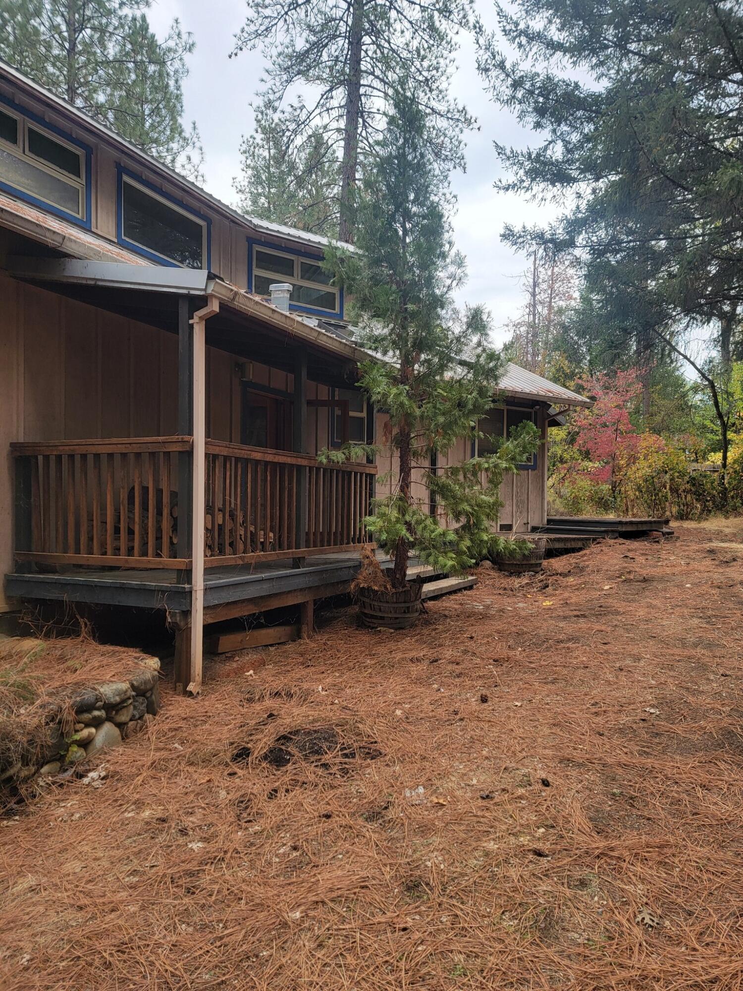 330 Lake Road Junction City, CA 96048 - Photo 30 of 50 a view of backyard with small cabin and wooden fence