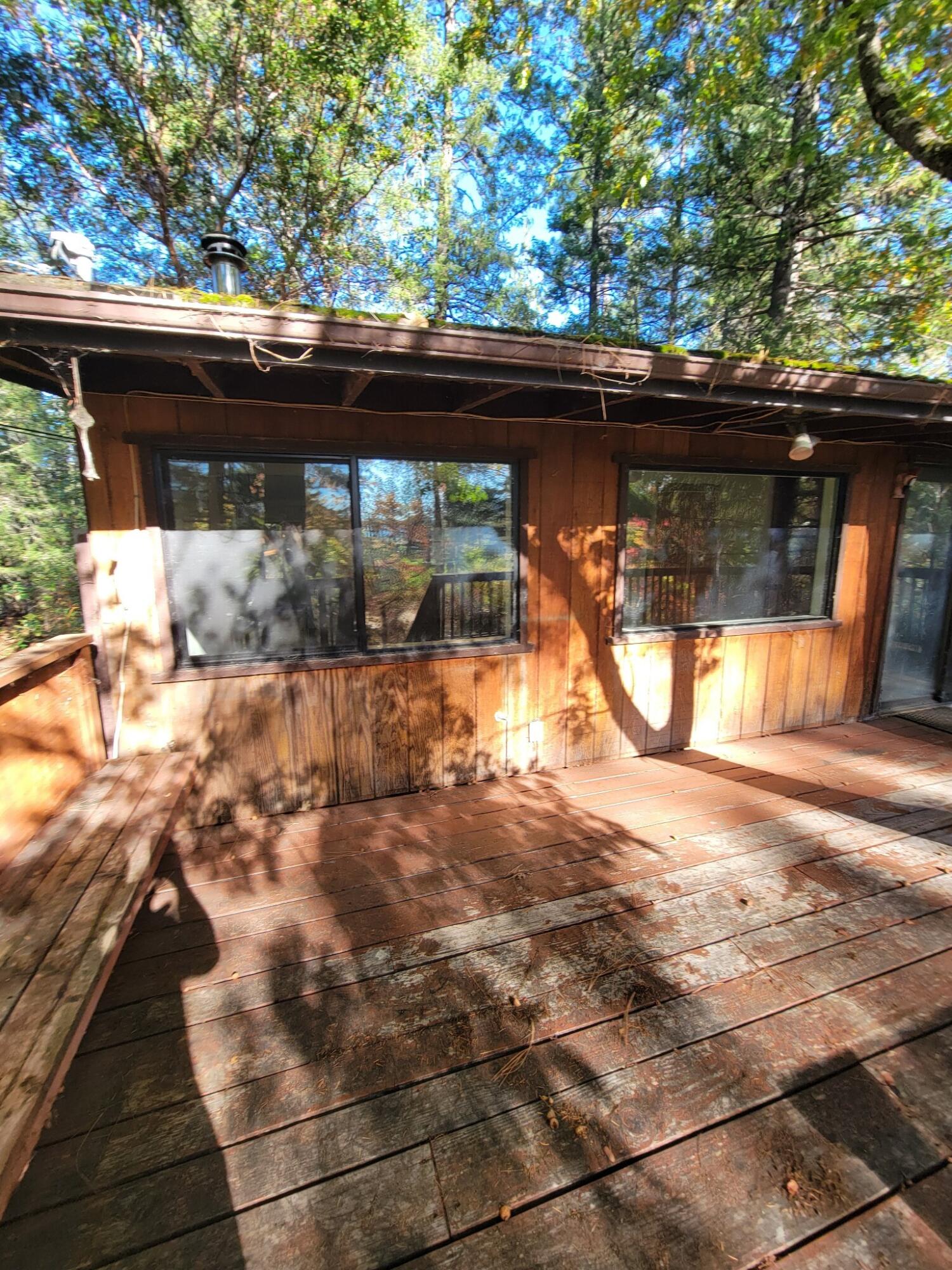 330 Lake Road Junction City, CA 96048 - Photo 4 of 50 a backyard of a house with yard and outdoor seating