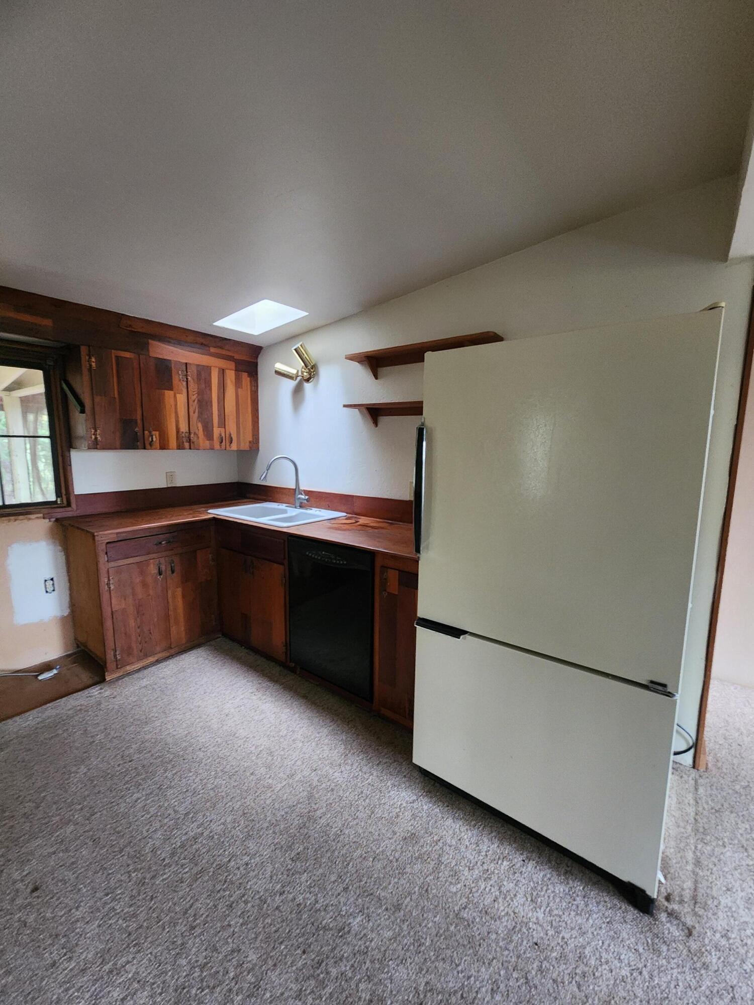 330 Lake Road Junction City, CA 96048 - Photo 8 of 50 a kitchen with stainless steel appliances granite countertop a refrigerator and a sink