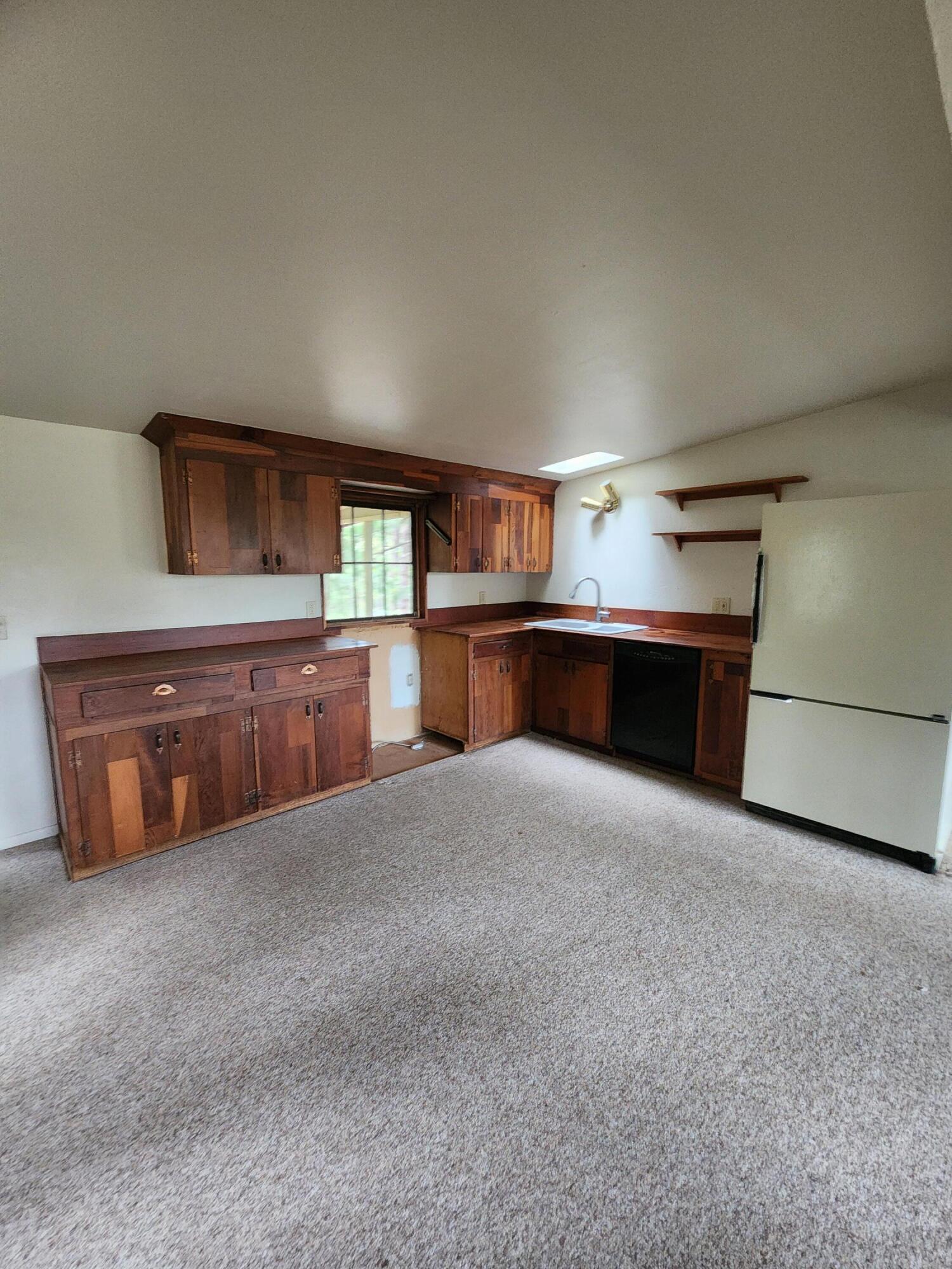 330 Lake Road Junction City, CA 96048 - Photo 9 of 50 a large kitchen with granite countertop a stove and a sink