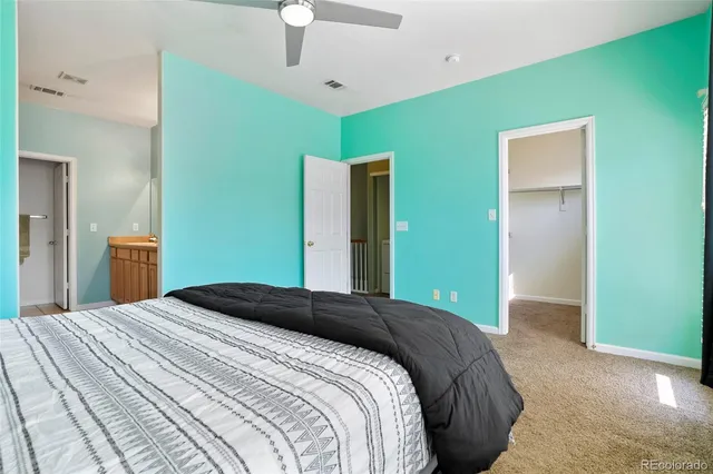 a bathroom with a granite countertop sink a mirror and a bathtub