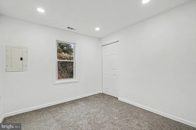 a view of a bathroom with wooden floor