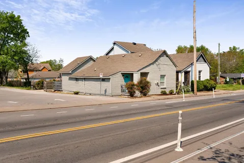 a view of street along with houses