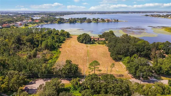 an aerial view of a city and lake view