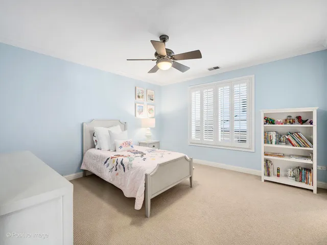 a bed room with a bed and a window