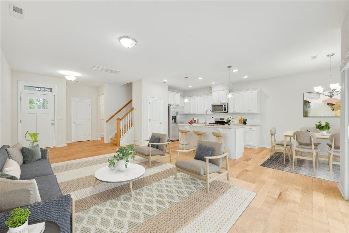 This virtually staged photo is just one of many ways to place furniture. Living Room