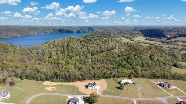 a bathroom with a bathtub and a picture of painted walls