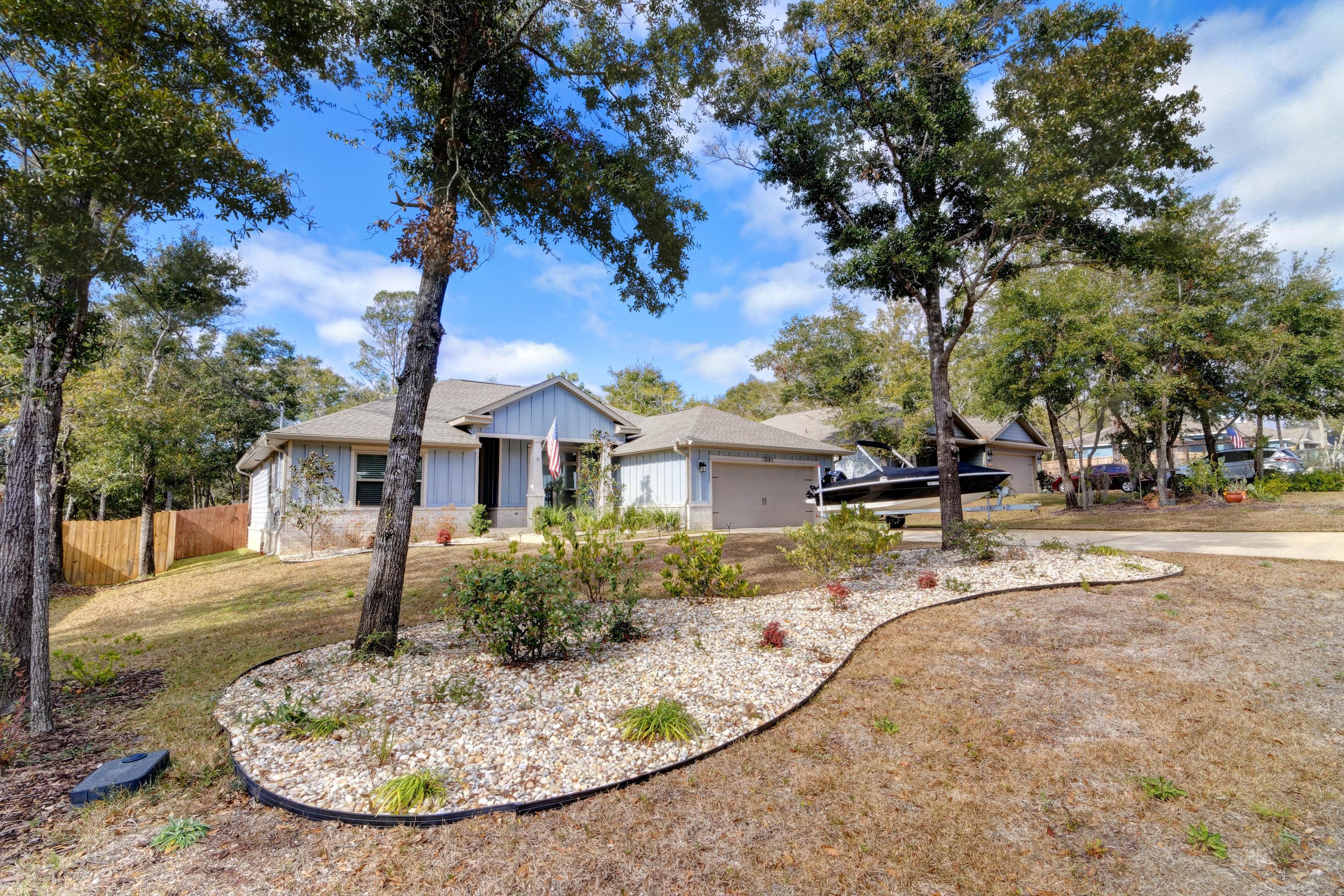 3083 5 Forks Road Navarre, FL 32566 - Photo 1 of 57 a view of a house with entertaining space