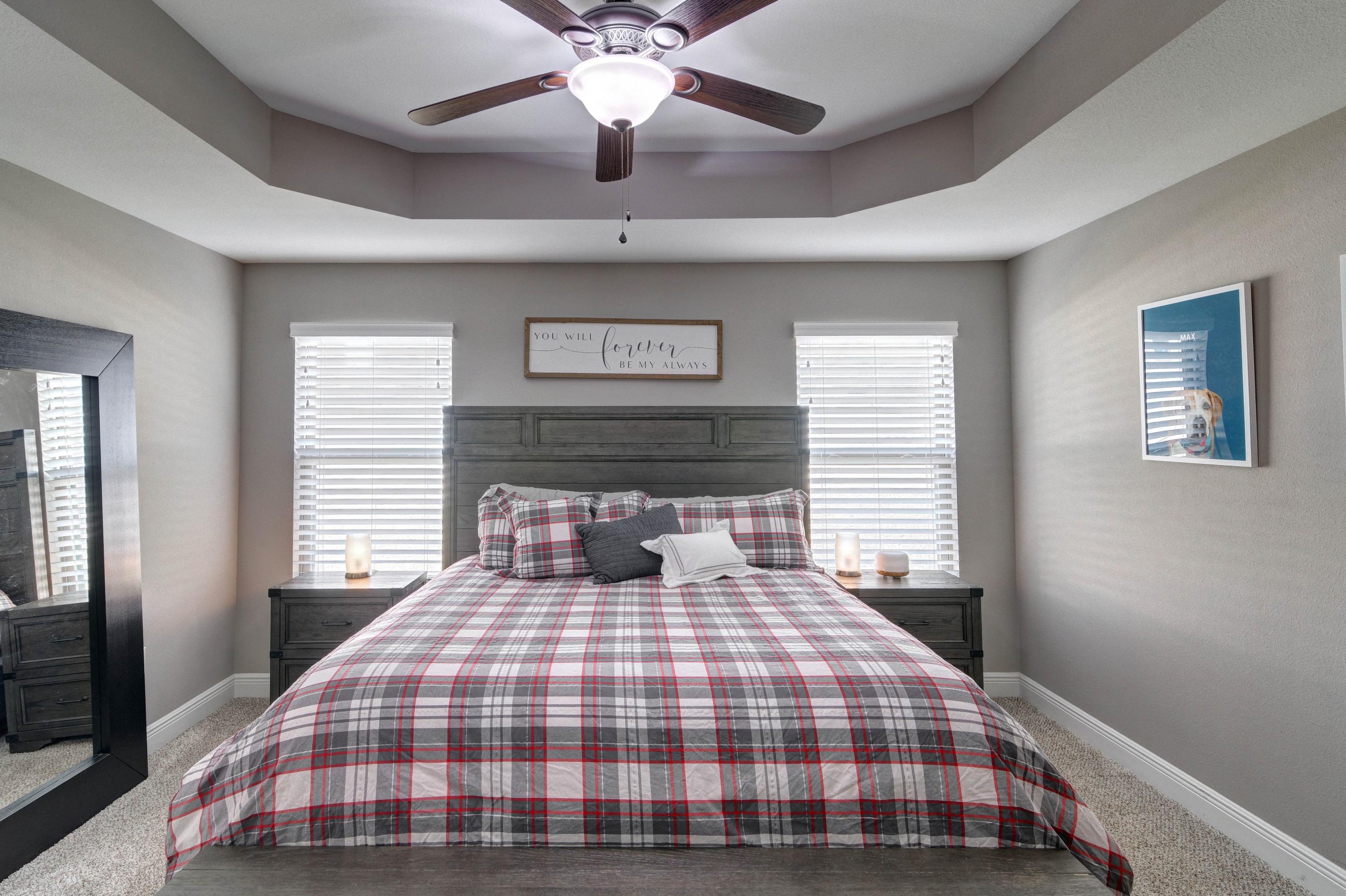 3083 5 Forks Road Navarre, FL 32566 - Photo 20 of 57 a bedroom with a large bed and a chandelier