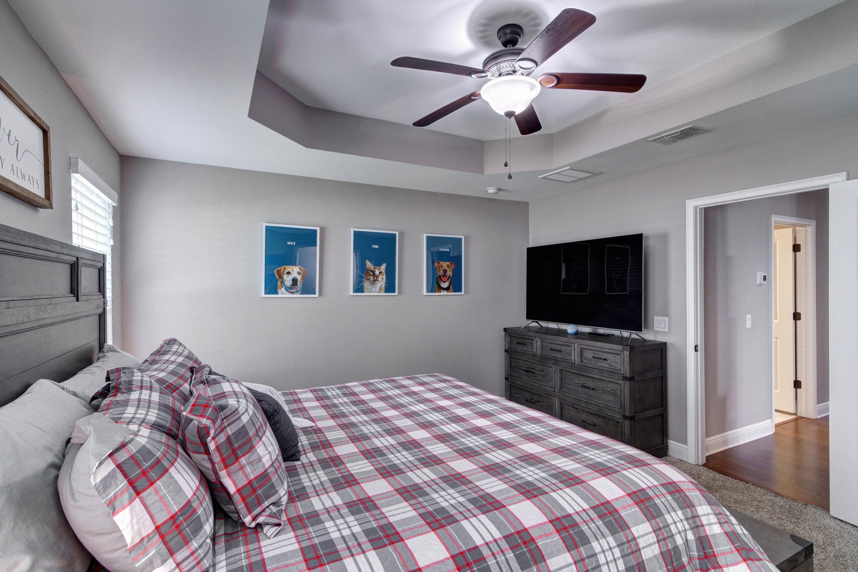 3083 5 Forks Road Navarre, FL 32566 - Photo 23 of 57 a bedroom with a bed and a flat screen tv