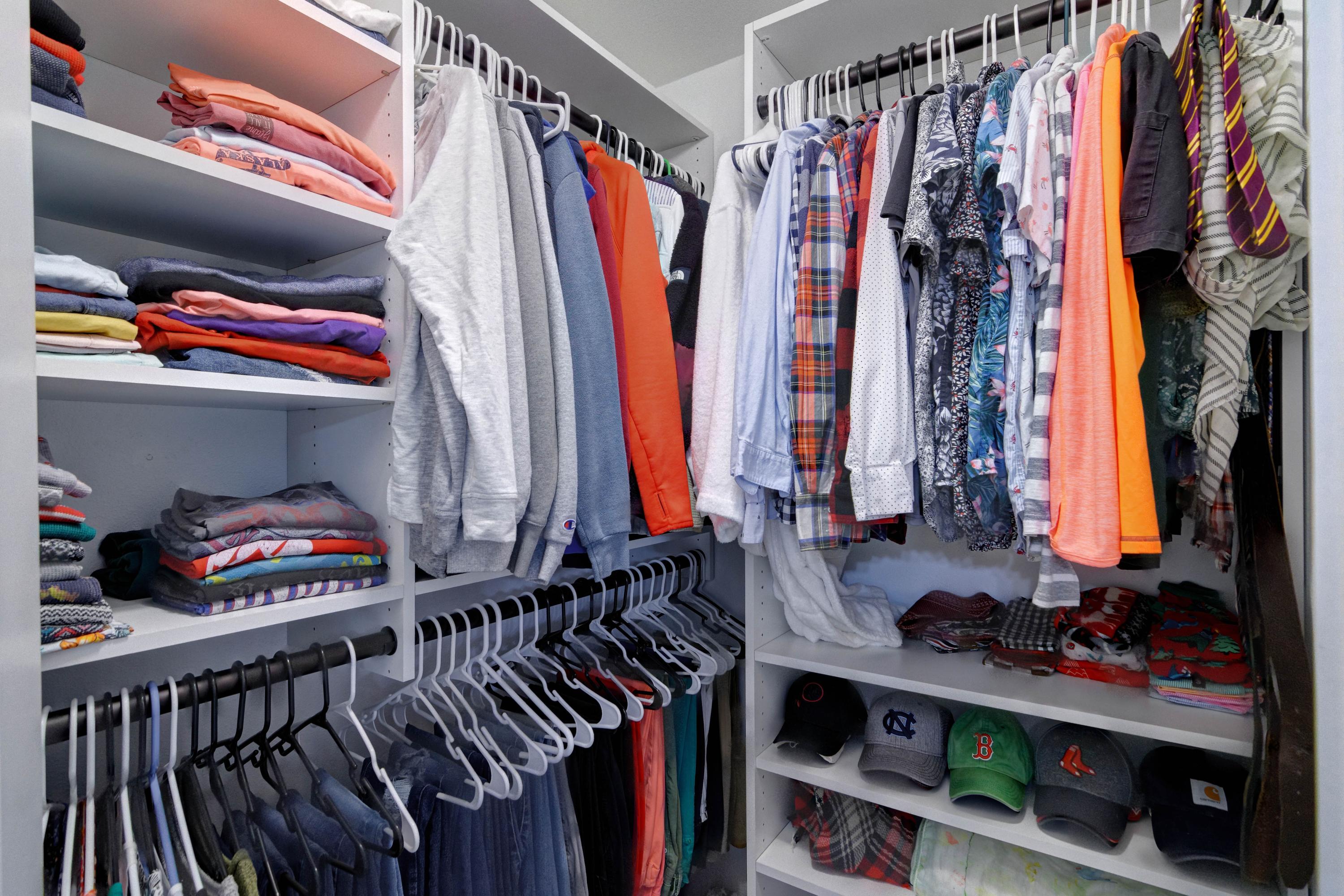 3083 5 Forks Road Navarre, FL 32566 - Photo 24 of 57 a view of walk in closet with clothes and shoes