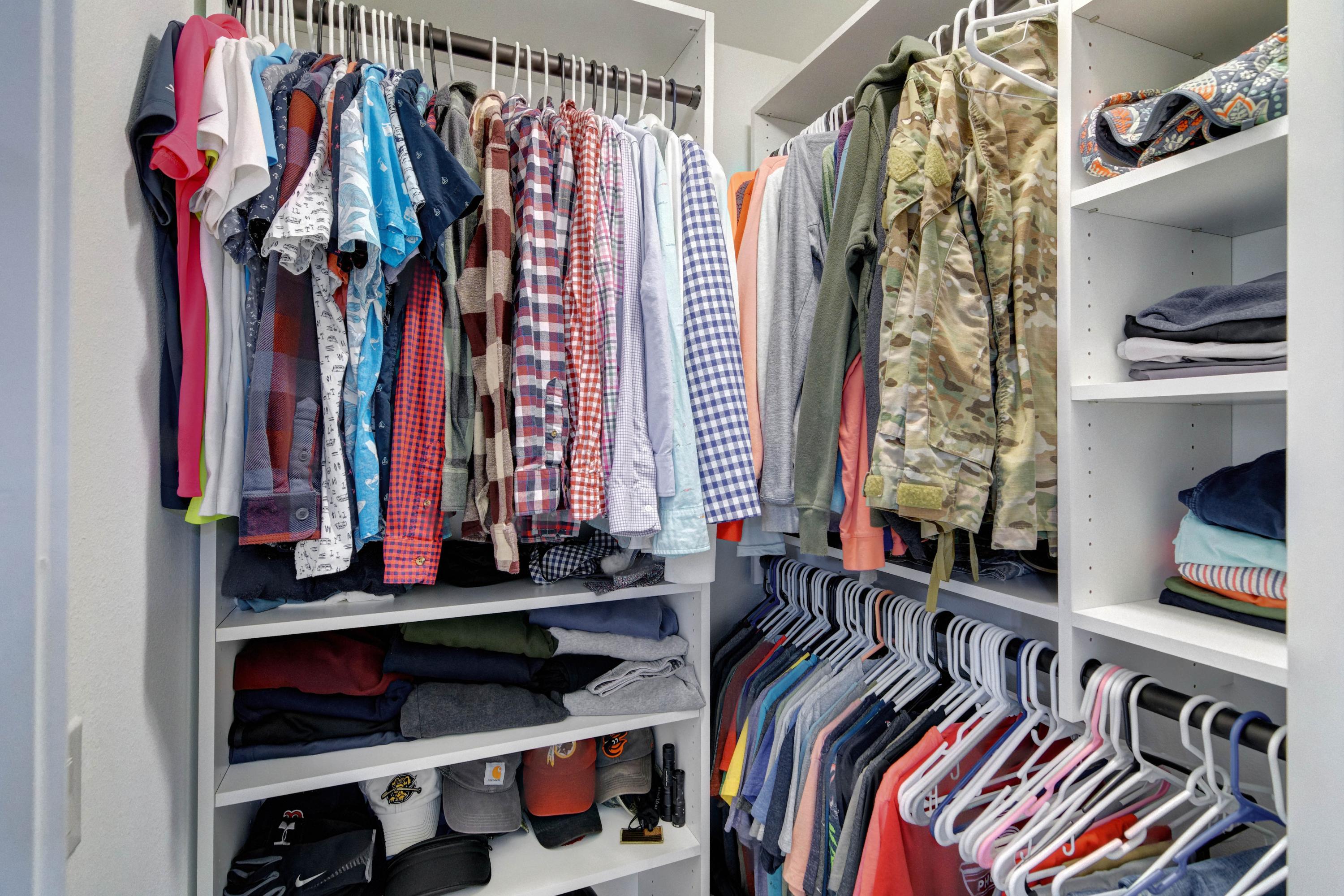 3083 5 Forks Road Navarre, FL 32566 - Photo 25 of 57 a view of walk in closet with clothes and shoes
