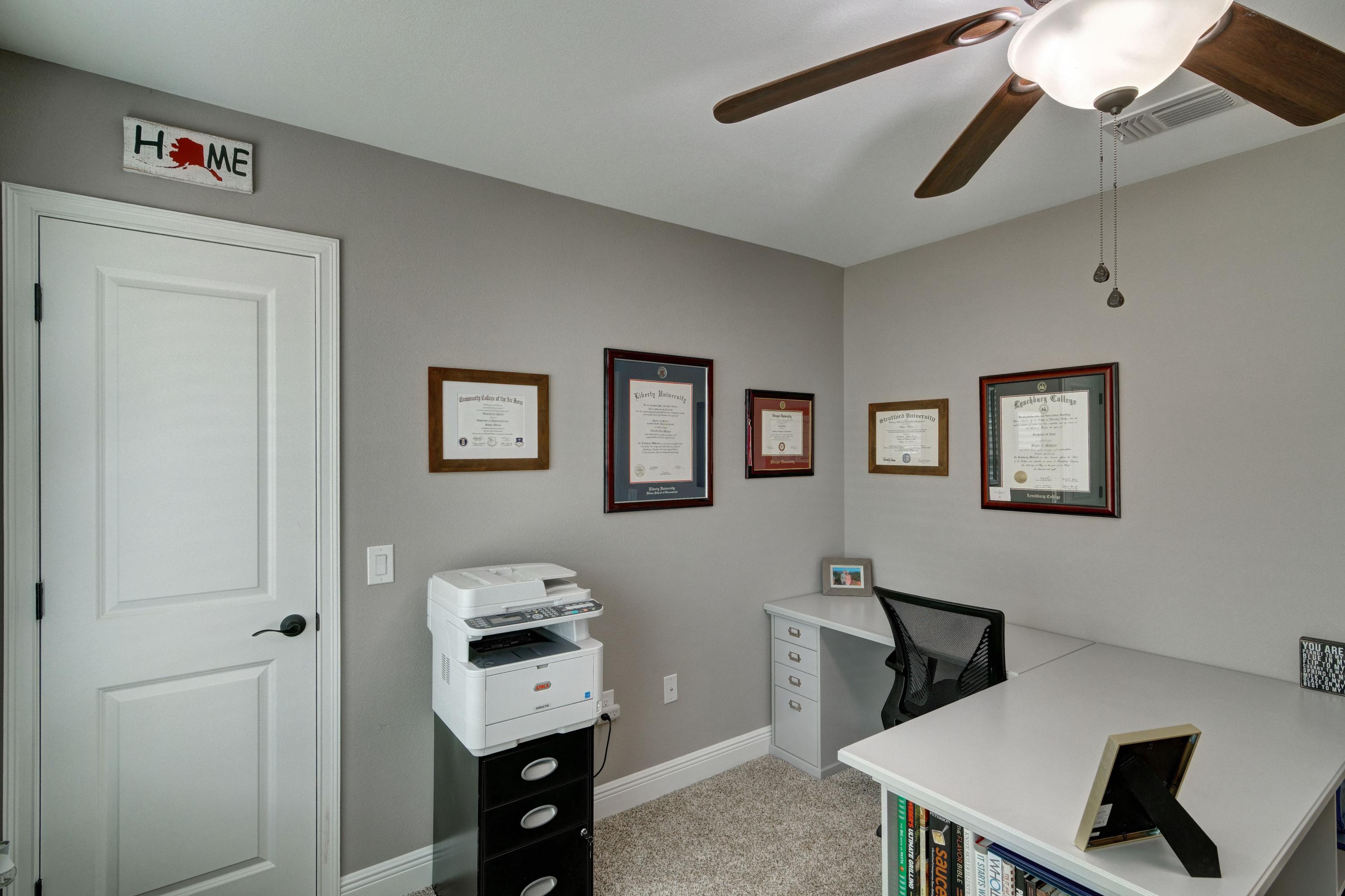 3083 5 Forks Road Navarre, FL 32566 - Photo 33 of 57 a hallway with a computer on a desk and chair