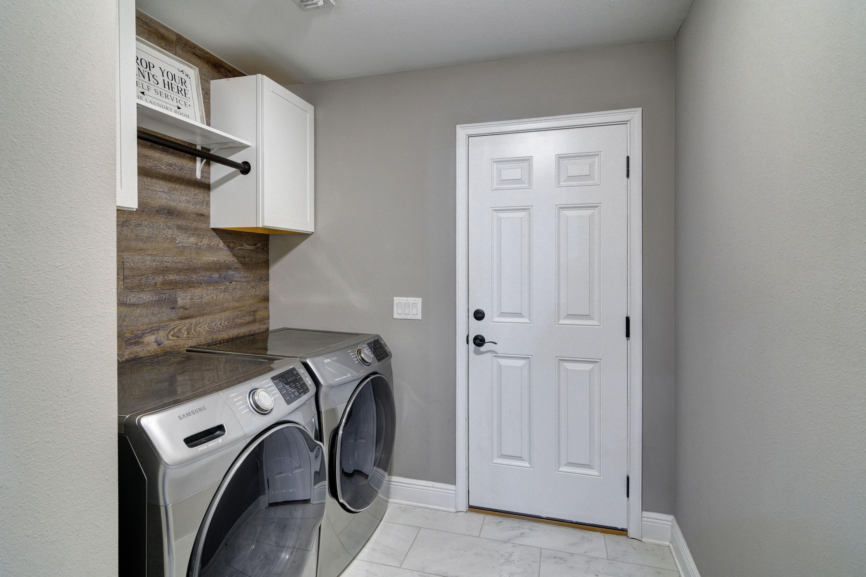 3083 5 Forks Road Navarre, FL 32566 - Photo 43 of 57 a view of storage and utility room with washer and dryer