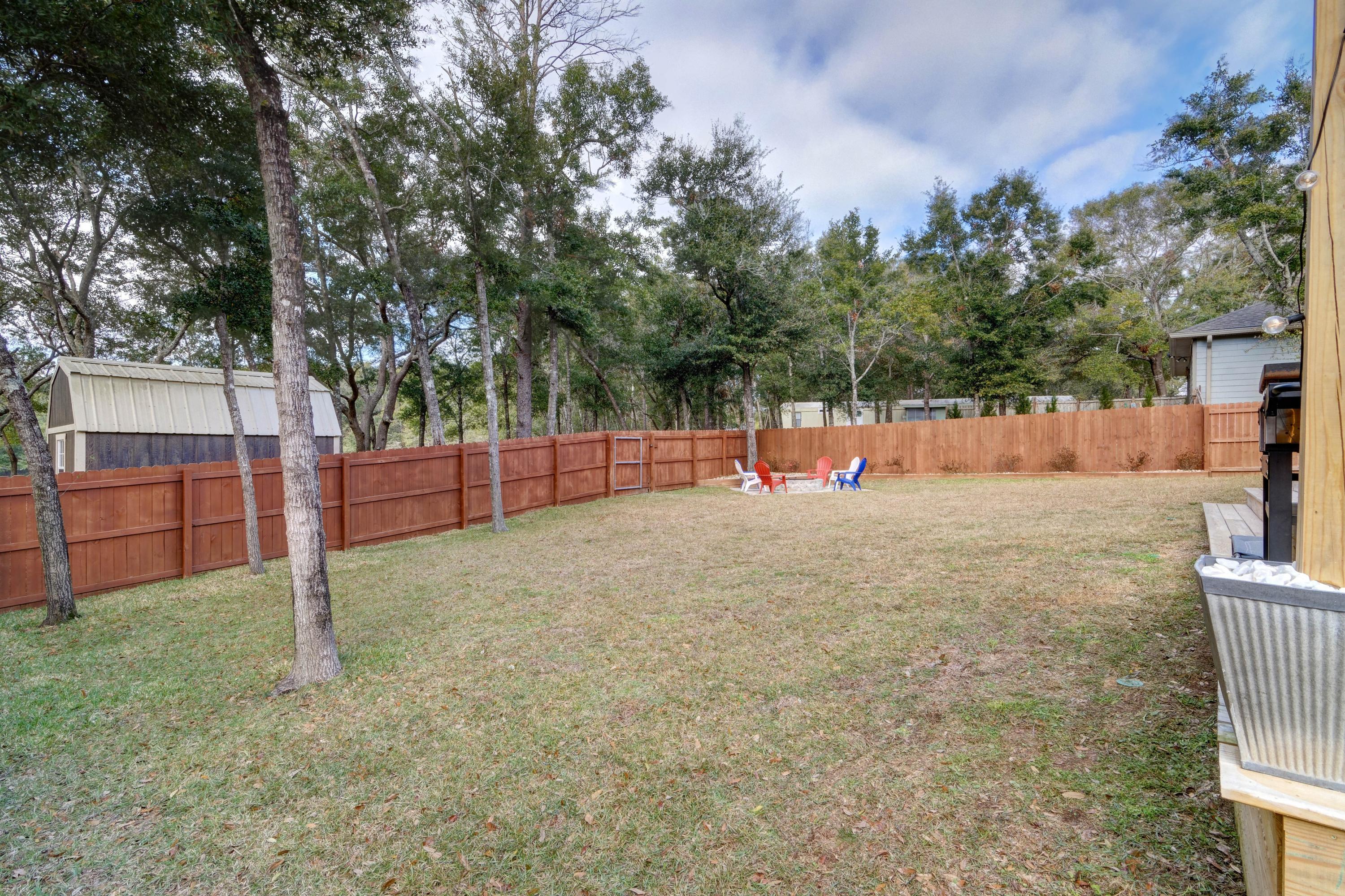 3083 5 Forks Road Navarre, FL 32566 - Photo 48 of 57 a view of backyard with a wooden fence
