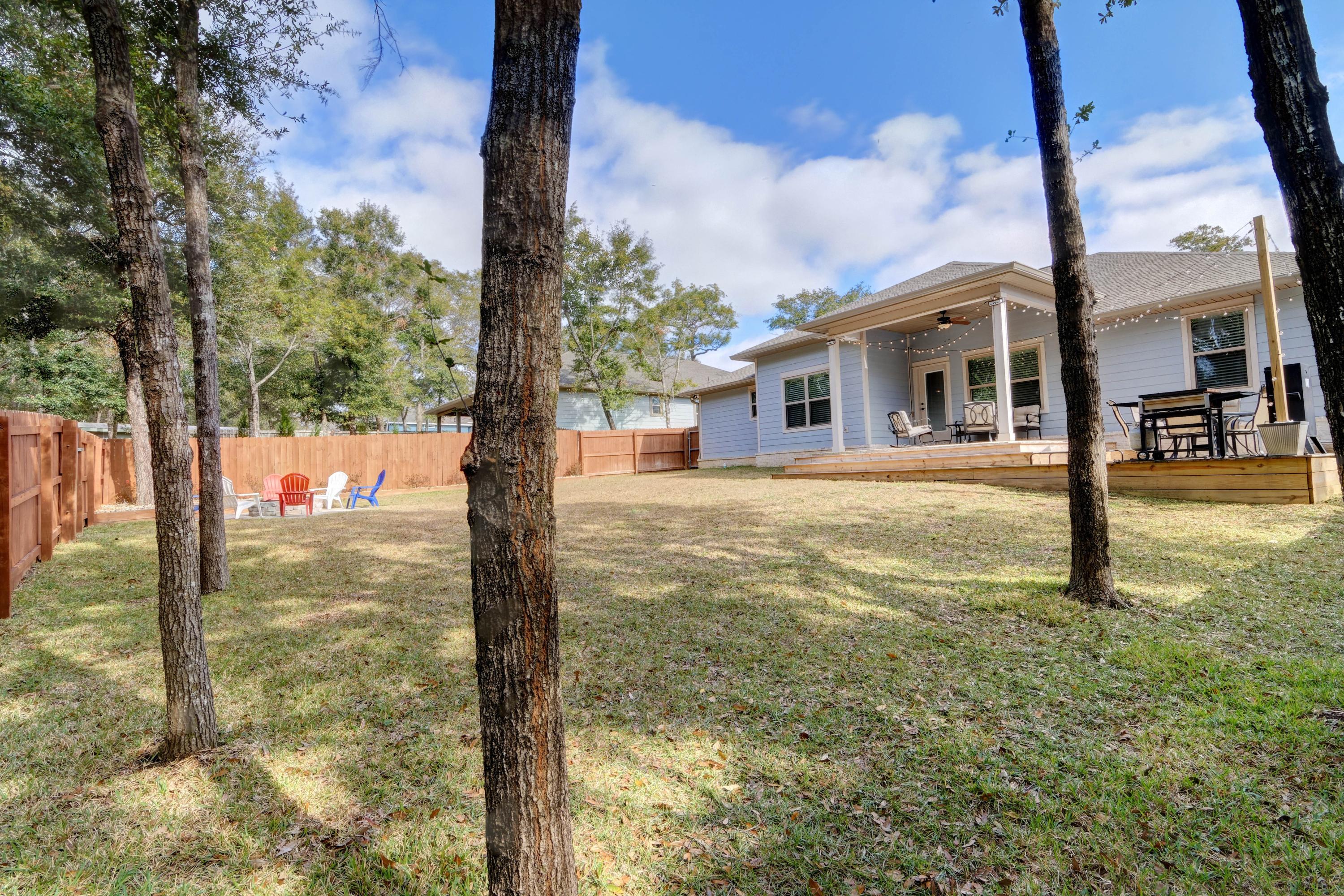 3083 5 Forks Road Navarre, FL 32566 - Photo 49 of 57 a front view of a house with a yard