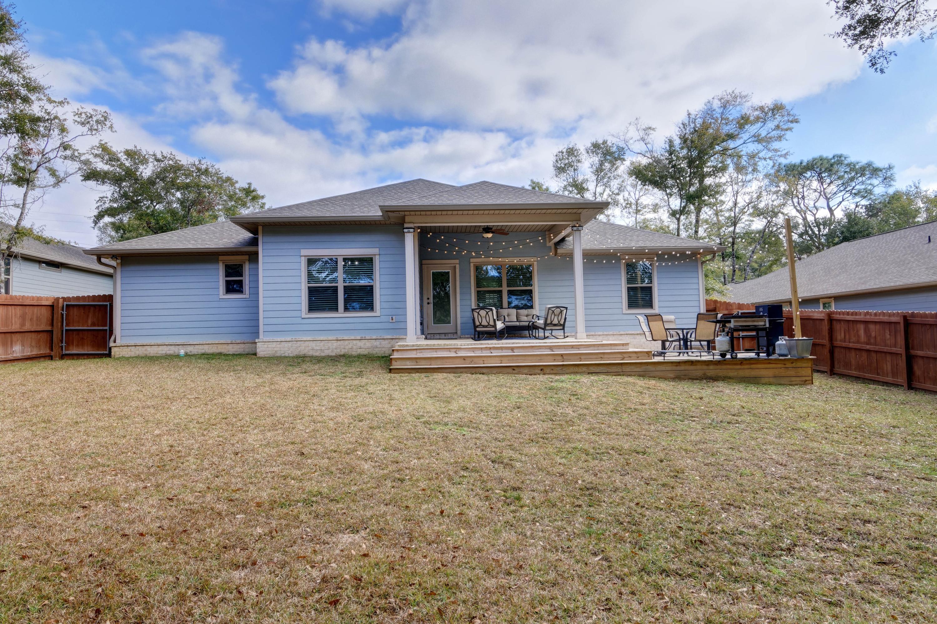 3083 5 Forks Road Navarre, FL 32566 - Photo 50 of 57 a house view with a garden space