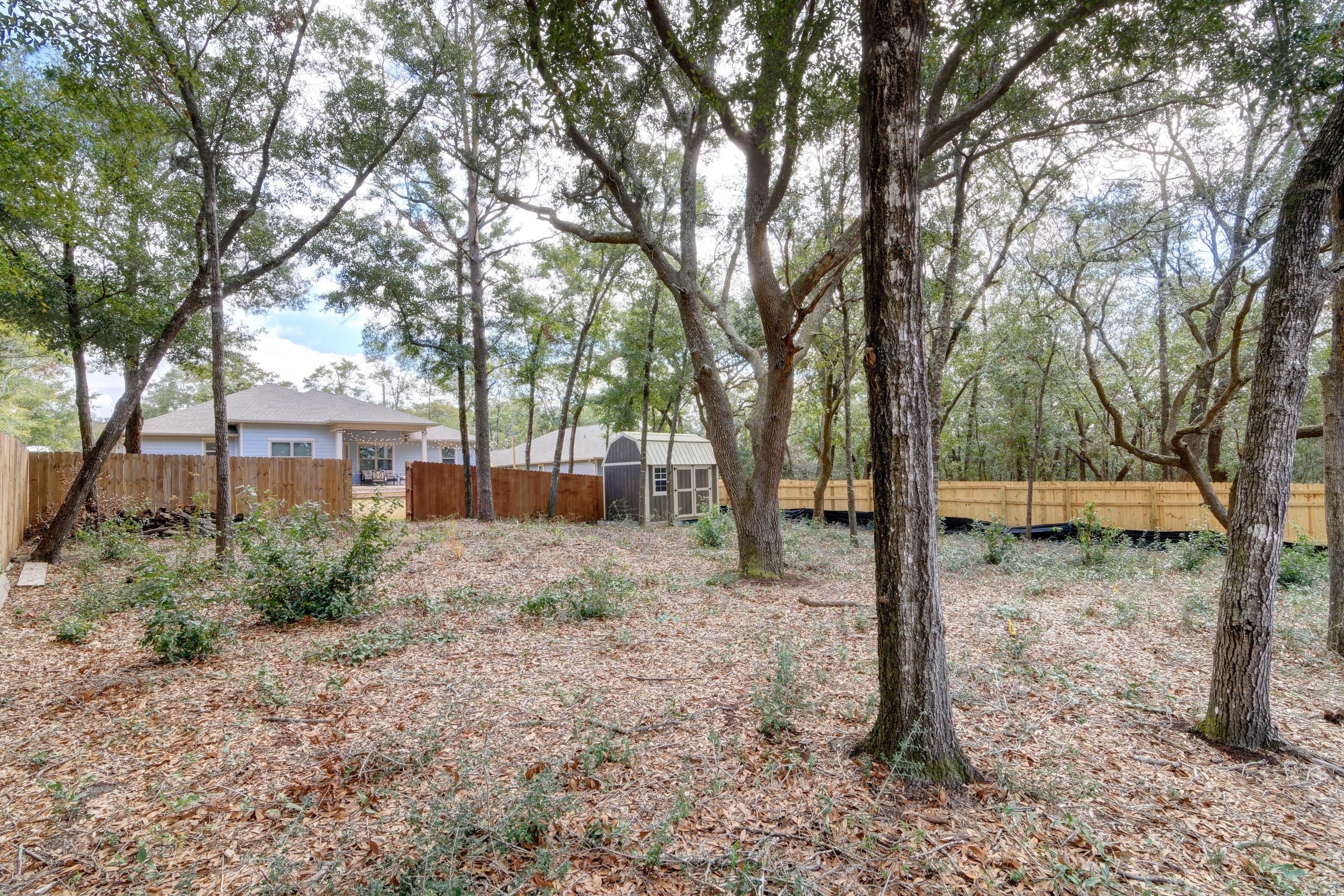 3083 5 Forks Road Navarre, FL 32566 - Photo 54 of 57 a view of a yard with a tree