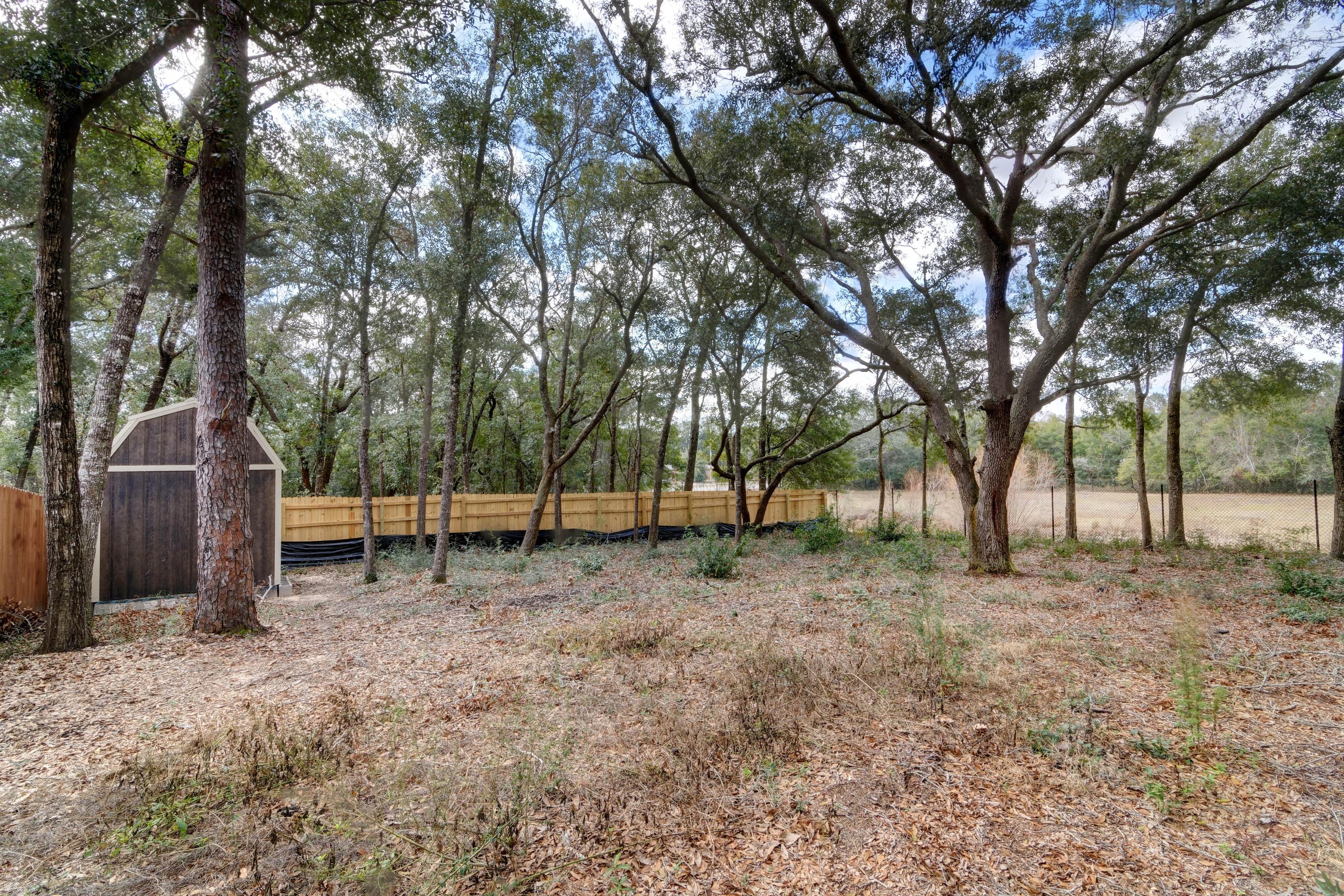 3083 5 Forks Road Navarre, FL 32566 - Photo 55 of 57 a backyard of a house with lots of green space