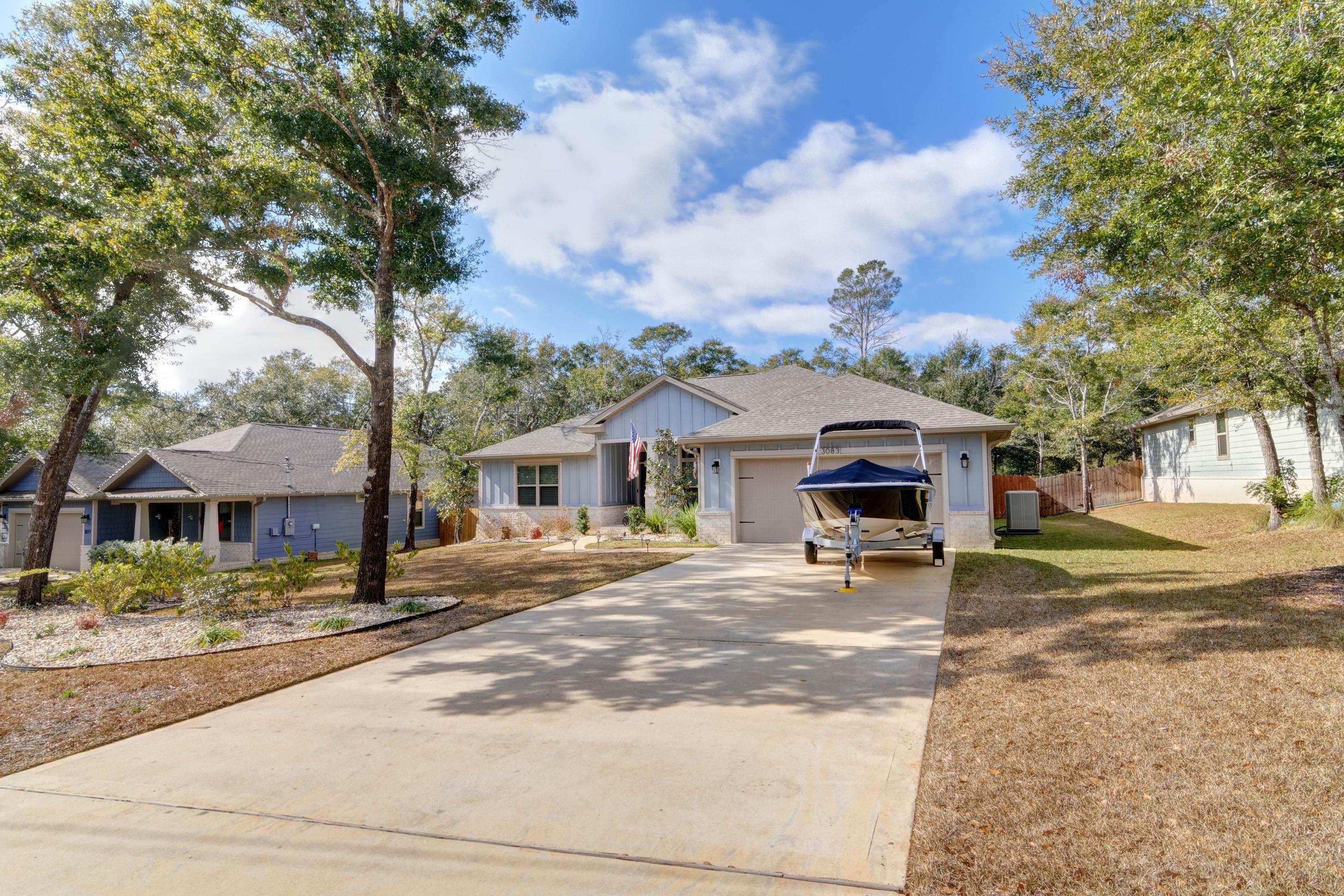 3083 5 Forks Road Navarre, FL 32566 - Photo 56 of 57 a house with trees in the background