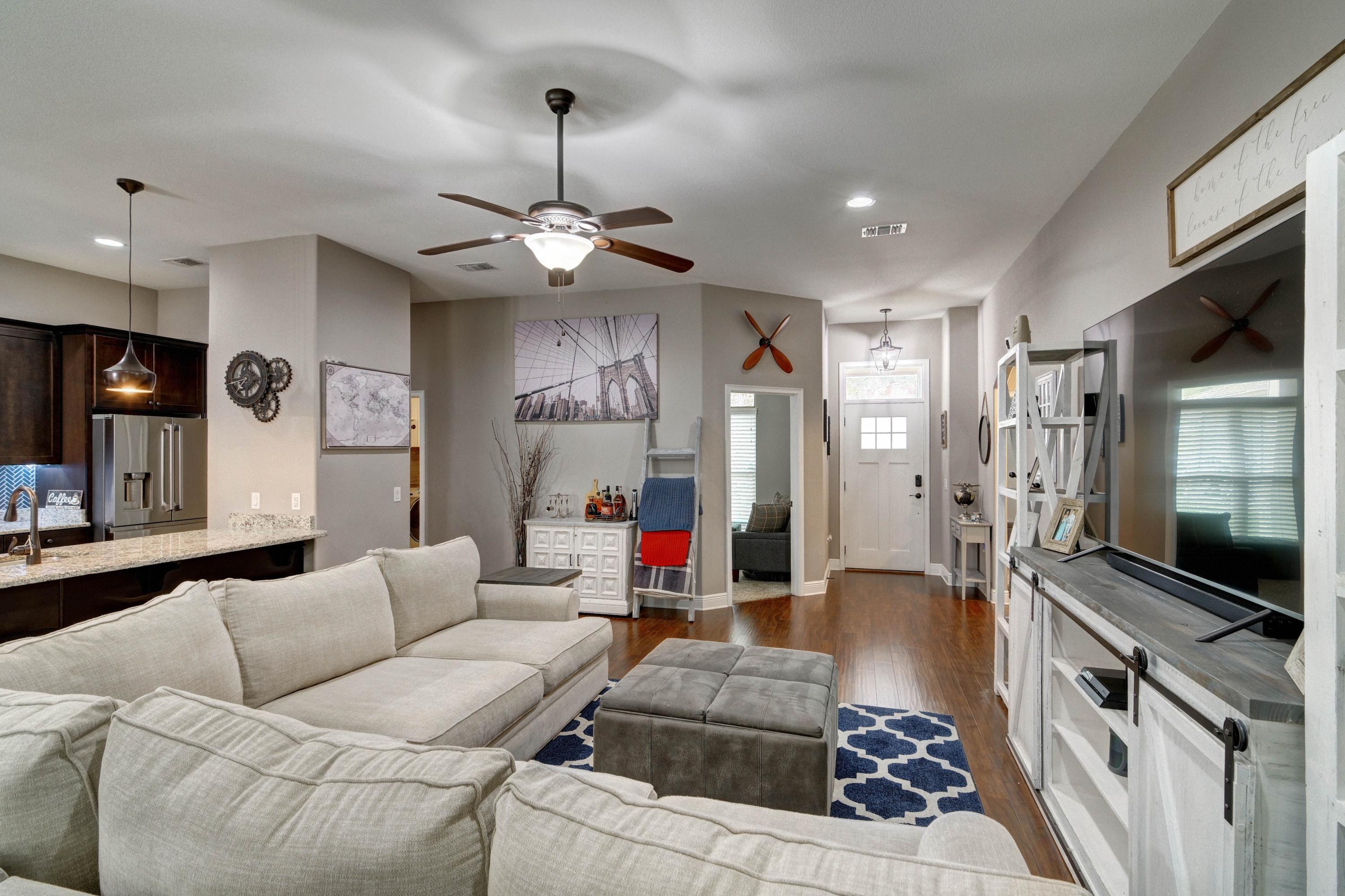 3083 5 Forks Road Navarre, FL 32566 - Photo 6 of 57 a living room with furniture and a flat screen tv