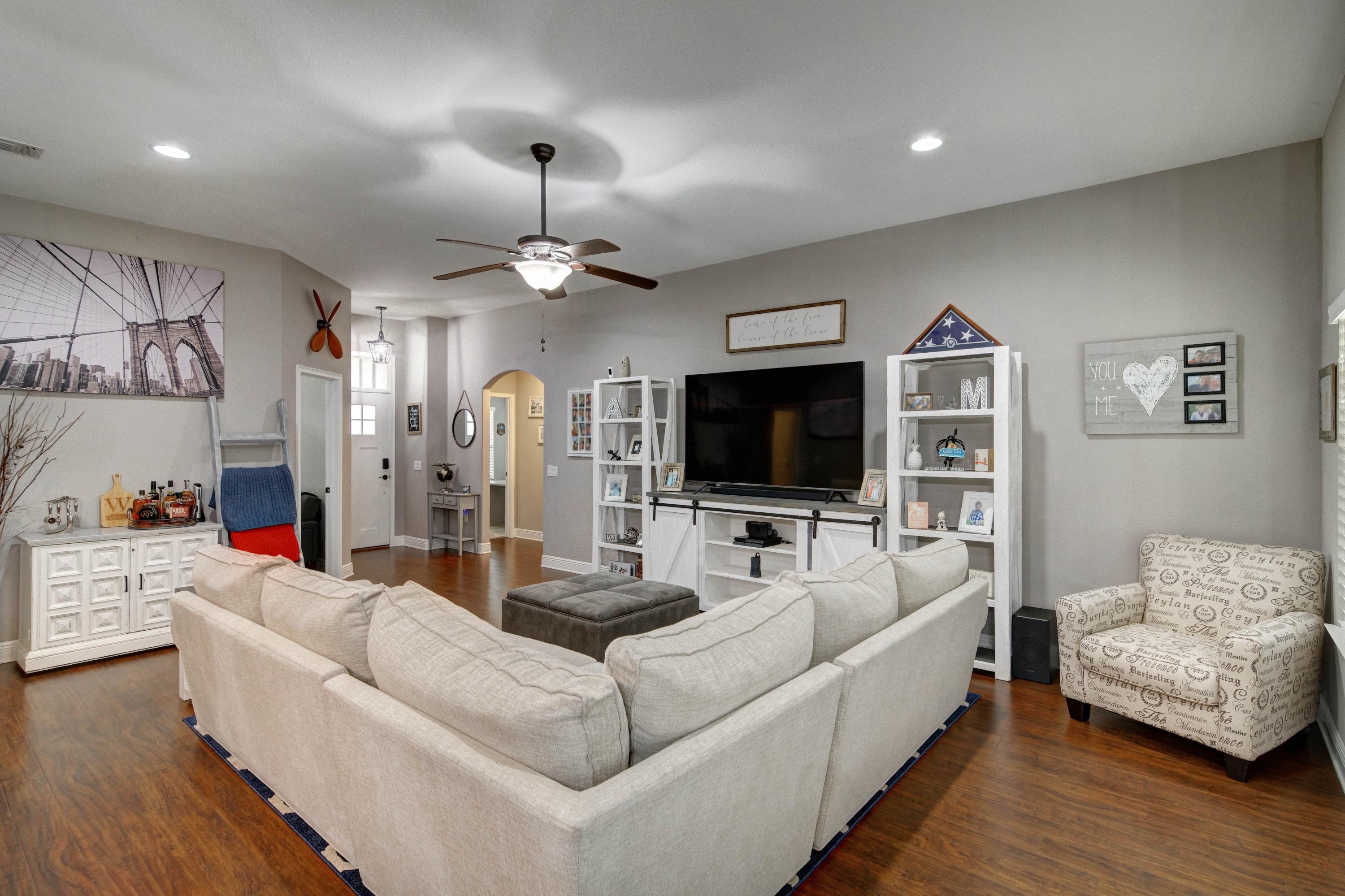 3083 5 Forks Road Navarre, FL 32566 - Photo 8 of 57 a living room with furniture and a flat screen tv