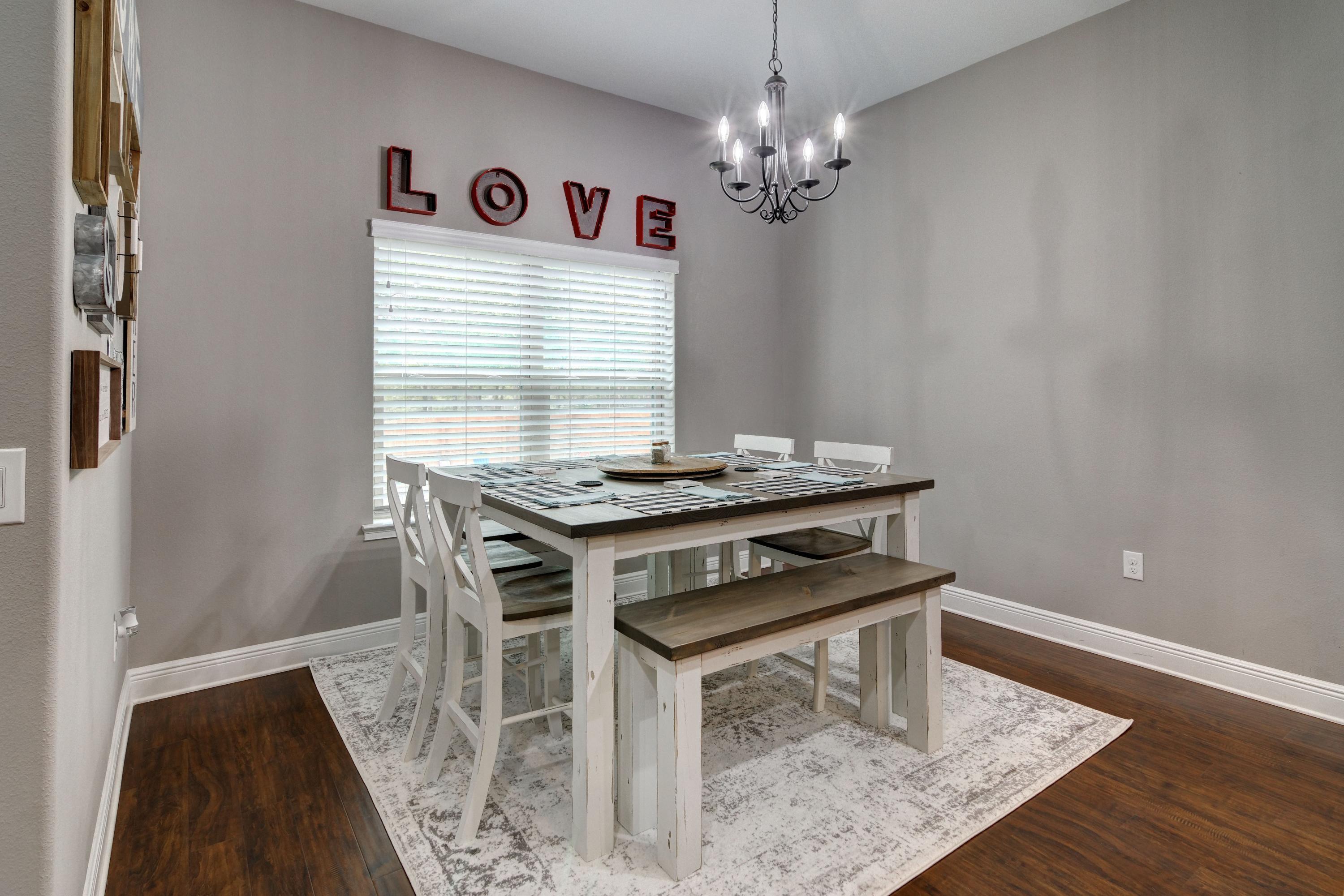 3083 5 Forks Road Navarre, FL 32566 - Photo 10 of 57 a dining room with a table and chairs