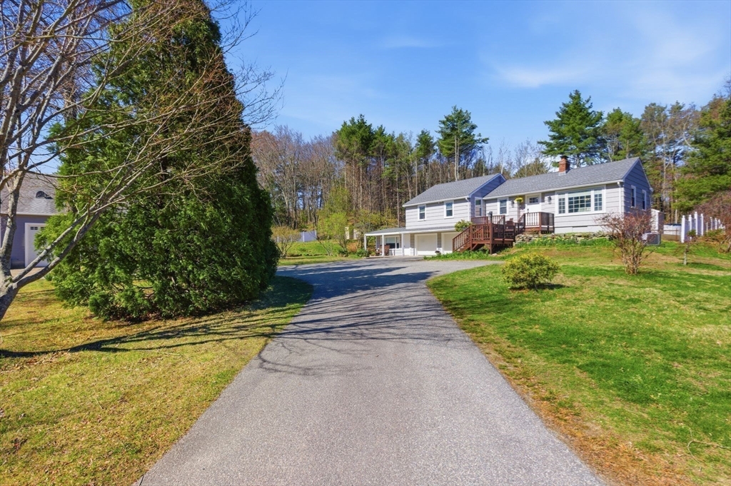 38 Woodland Road Georgetown, MA 01833 - Photo 41 of 42 a house with garden in front of it