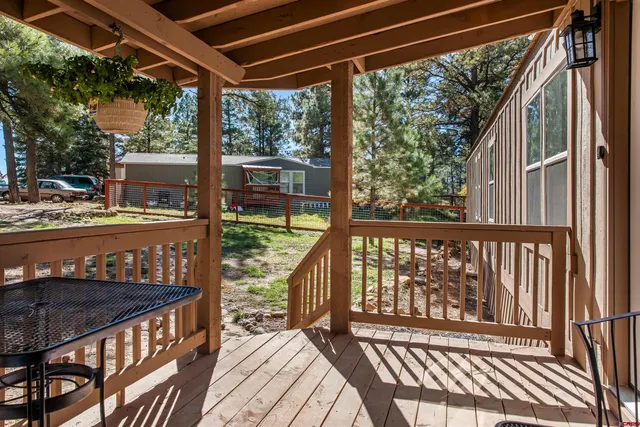 a view of balcony with wooden floor