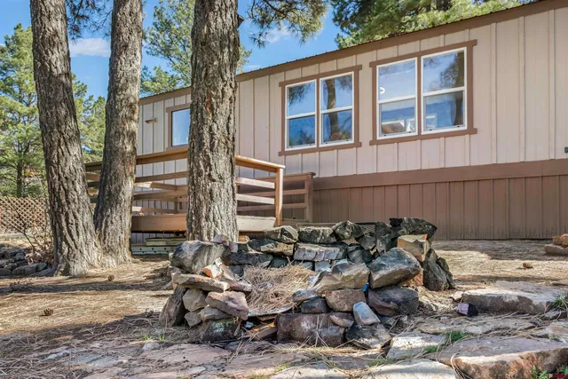 a couple of table and chairs in front of a building