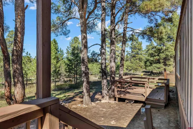 a view of a chairs and table in the patio