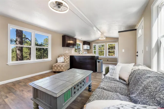 a living room with furniture and a window
