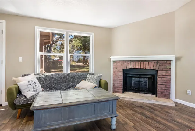 a bedroom with a bed and a fireplace