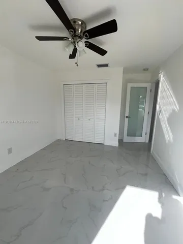a view of a livingroom with a ceiling fan