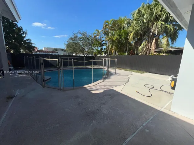 a view of a backyard of the house
