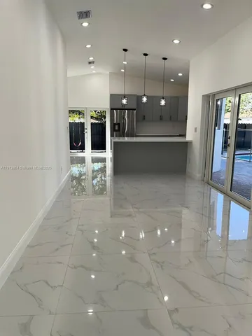 a large room with lots of table and chairs