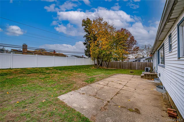 a view of a swimming pool with a yard