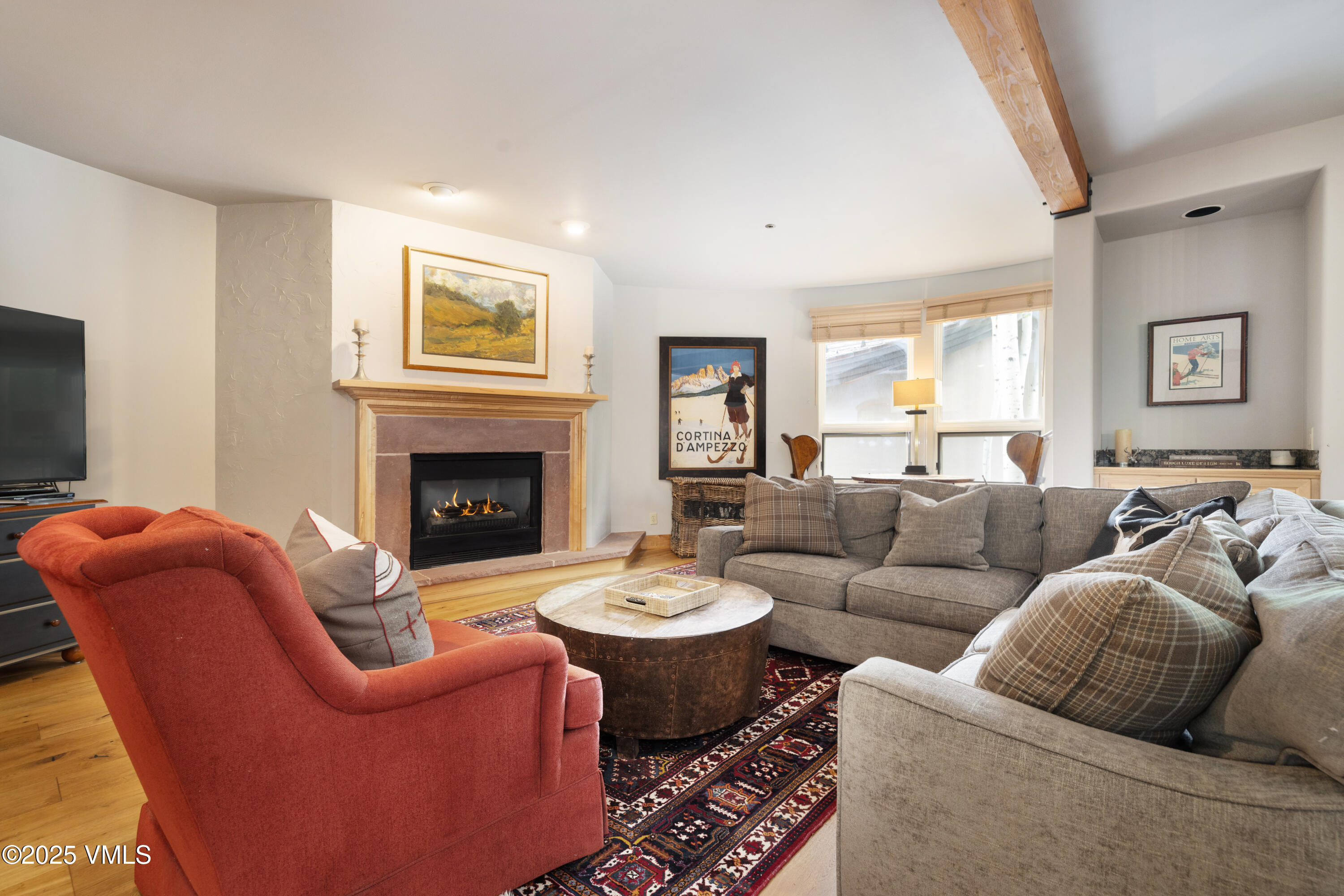 66 Arrowhead Circle, Unit 13 Edwards, CO 81632 - Photo 1 of 12 a living room with furniture a fireplace and a flat screen tv