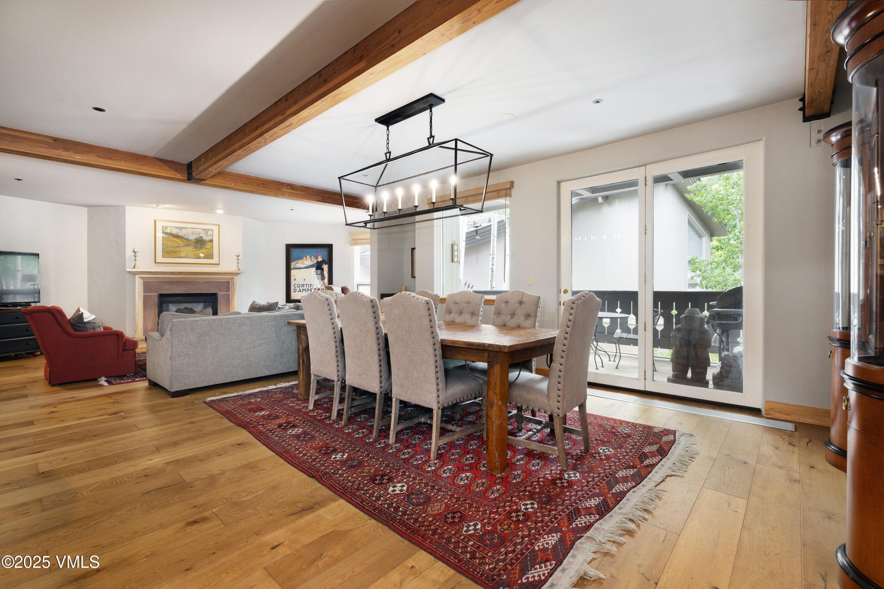 66 Arrowhead Circle, Unit 13 Edwards, CO 81632 - Photo 2 of 12 a living room with furniture a dining table and a floor to ceiling window