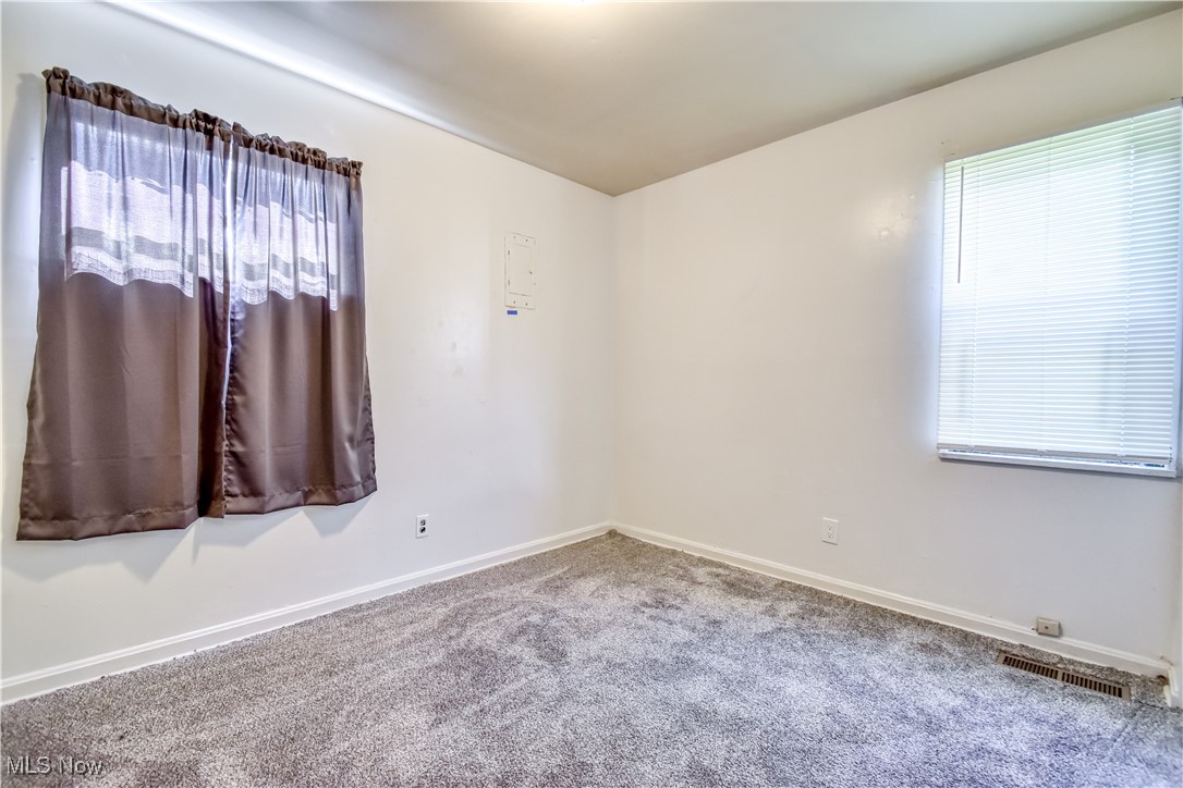 4380 Wyatt Road Cleveland, OH 44128 - Photo 5 of 26 Empty room featuring carpet flooring and baseboards