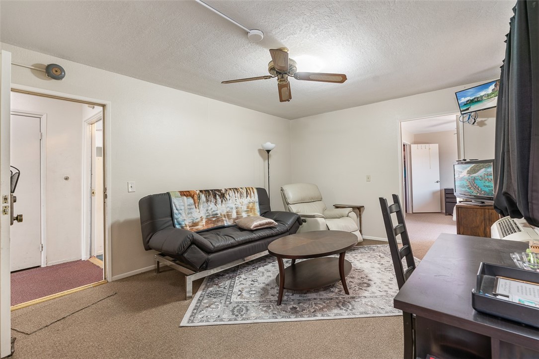6079 La Prada Los Angeles, CA 90042 - Photo 6 of 32 a living room with furniture and a flat screen tv