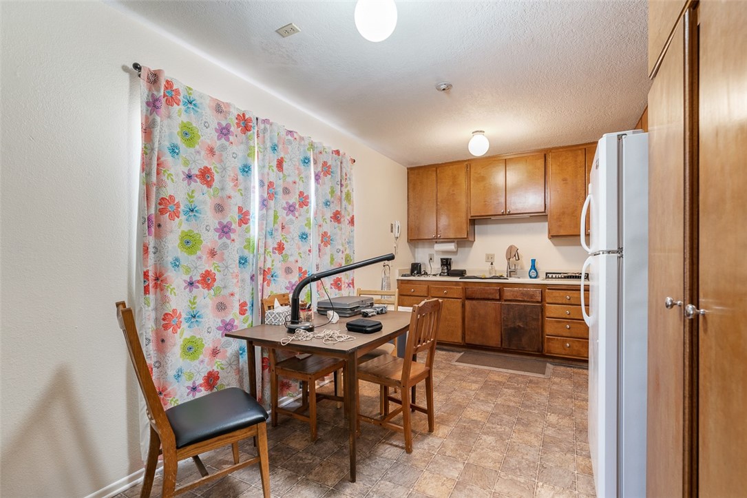 6079 La Prada Los Angeles, CA 90042 - Photo 9 of 32 a kitchen that has a dining table and appliances