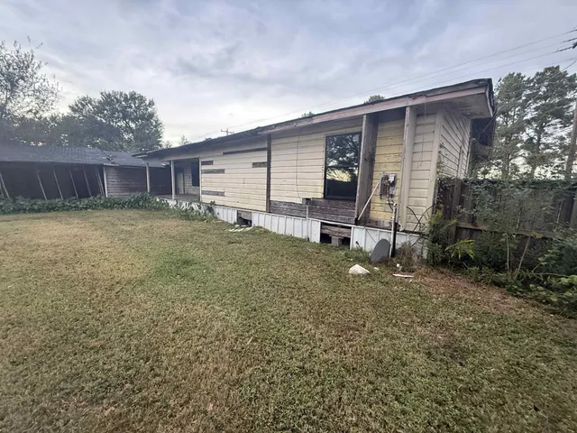 a backyard of a house with seating space