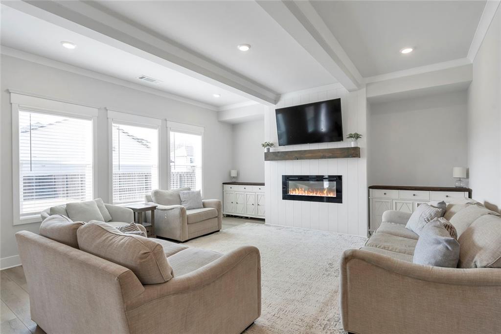 5316 Milford Road Gainesville, GA 30507 - Photo 12 of 44 a living room with furniture and a flat screen tv