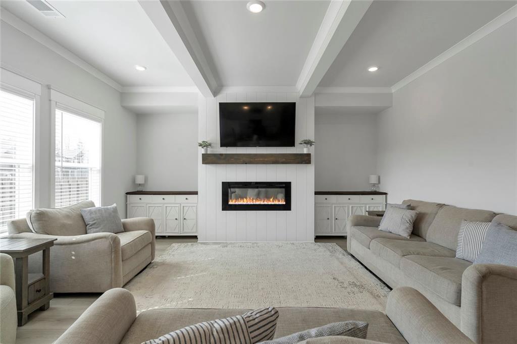 5316 Milford Road Gainesville, GA 30507 - Photo 13 of 44 a living room with furniture and a flat screen tv