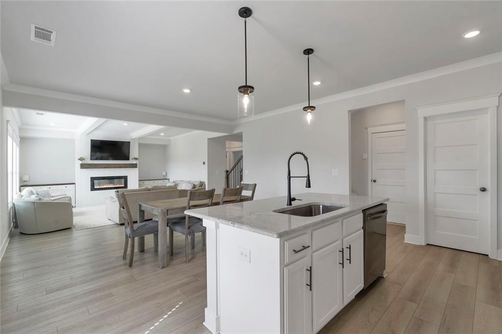 5316 Milford Road Gainesville, GA 30507 - Photo 20 of 44 a kitchen that has a sink a table and chairs in it