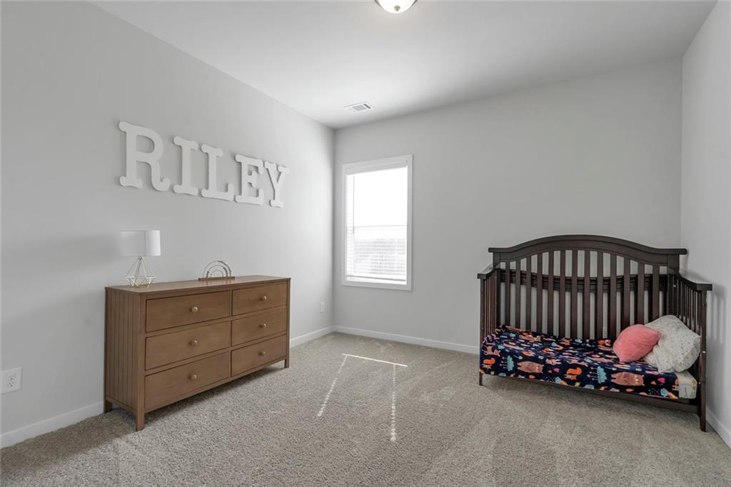 5316 Milford Road Gainesville, GA 30507 - Photo 28 of 44 a bedroom with a bed and a window